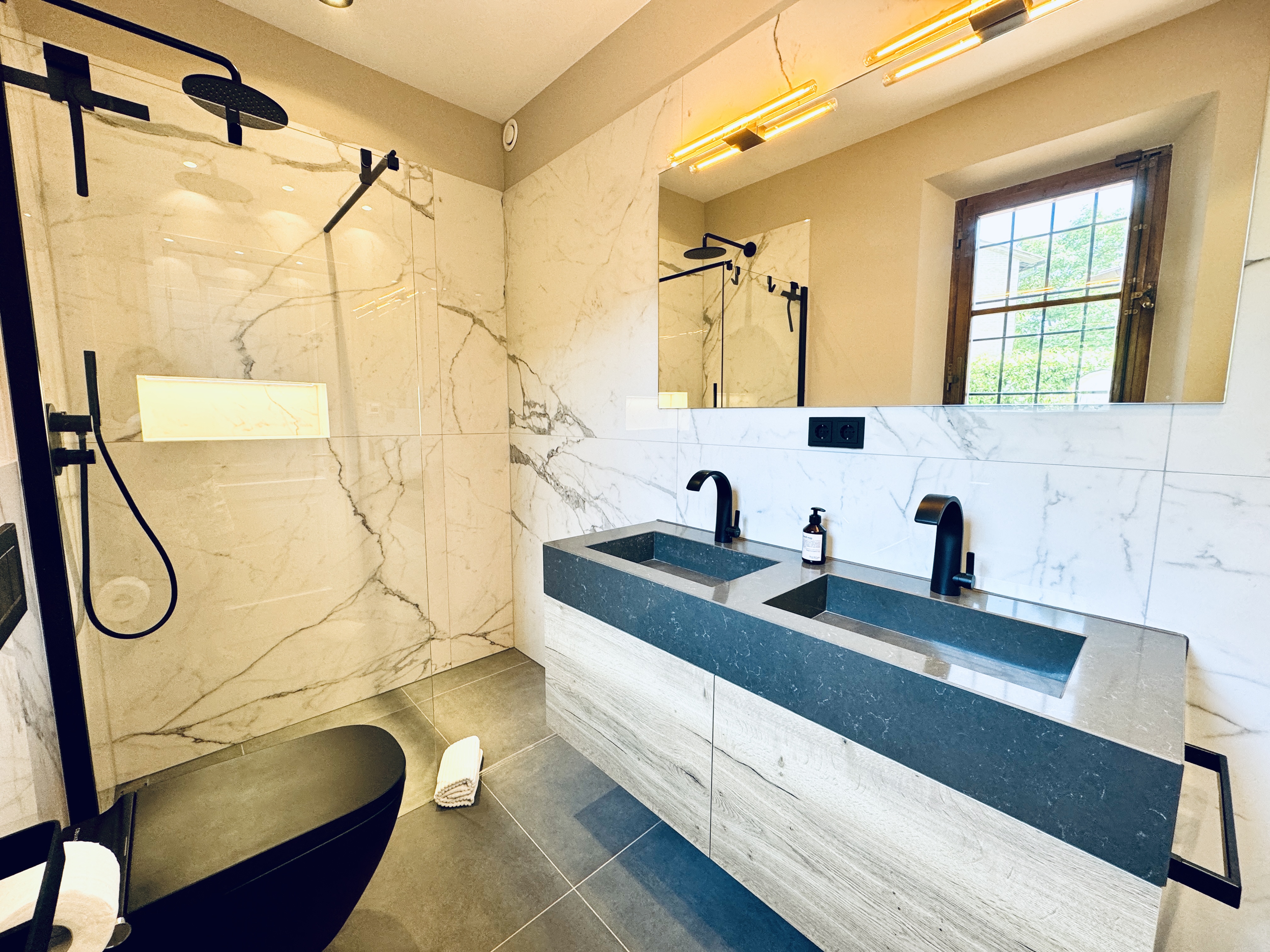Designer bathroom with black fixtures