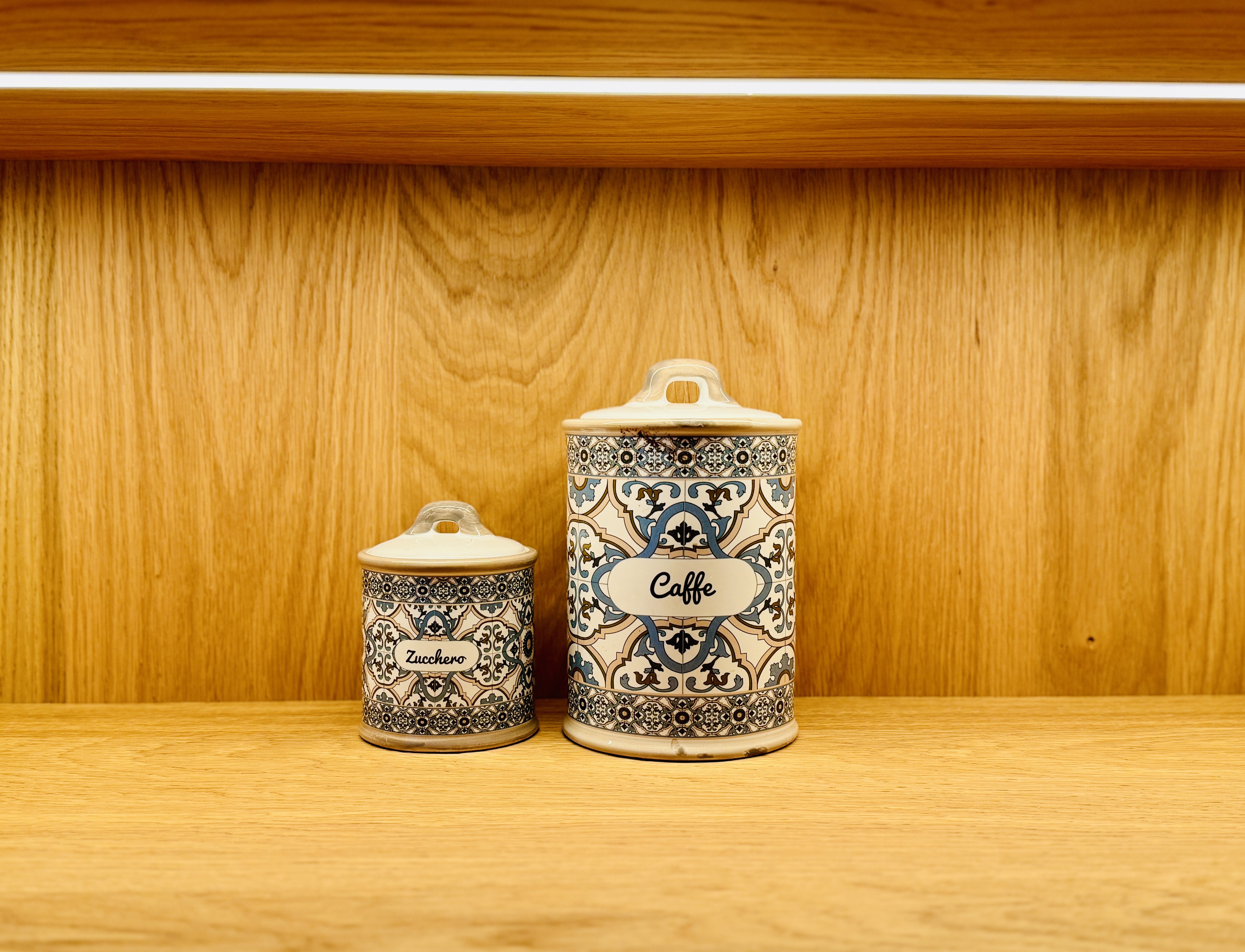 Italian coffee and sugar jars on kitchen shelf