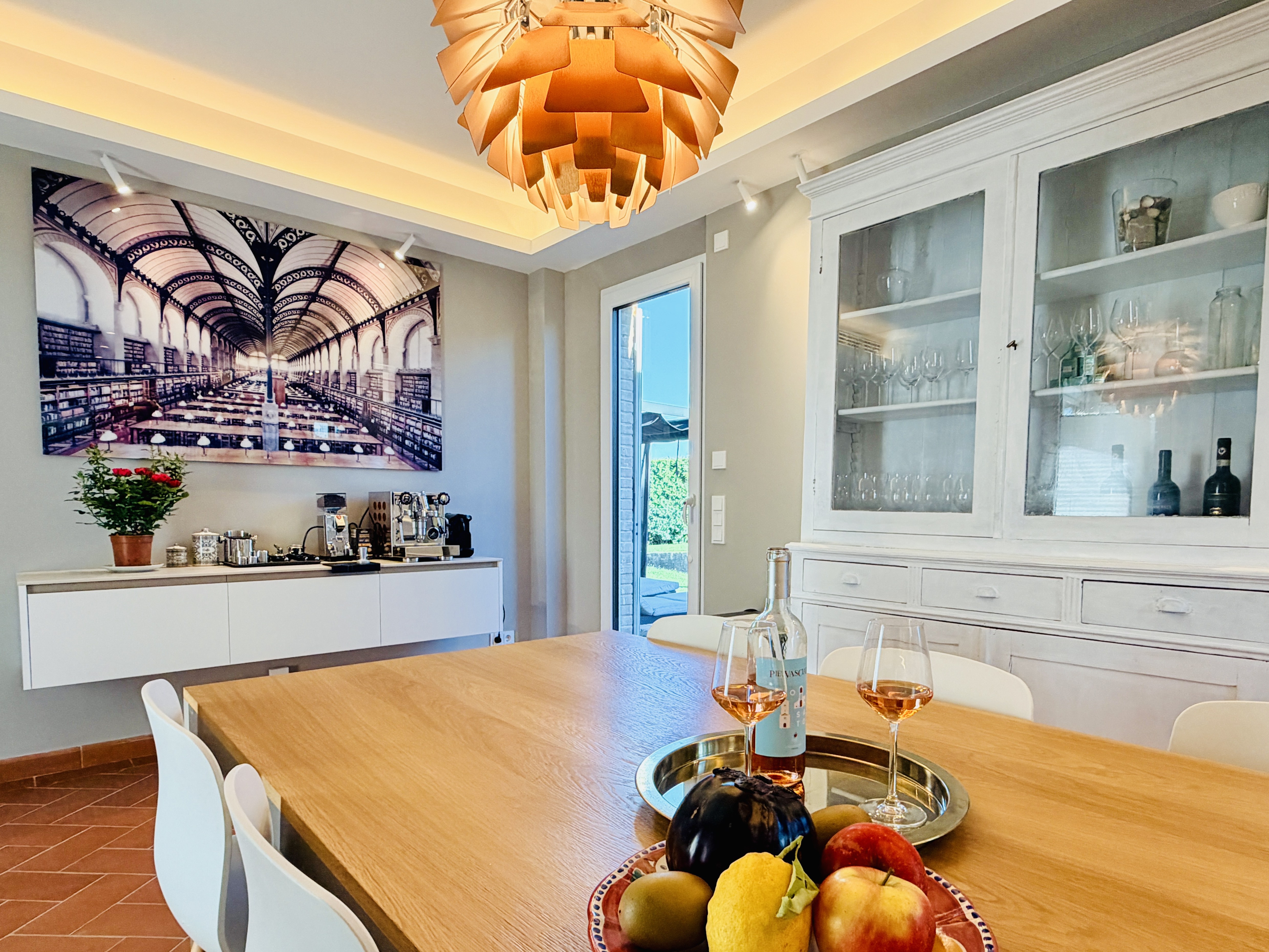 Kitchen dining table with rosé wine and fresh fruit