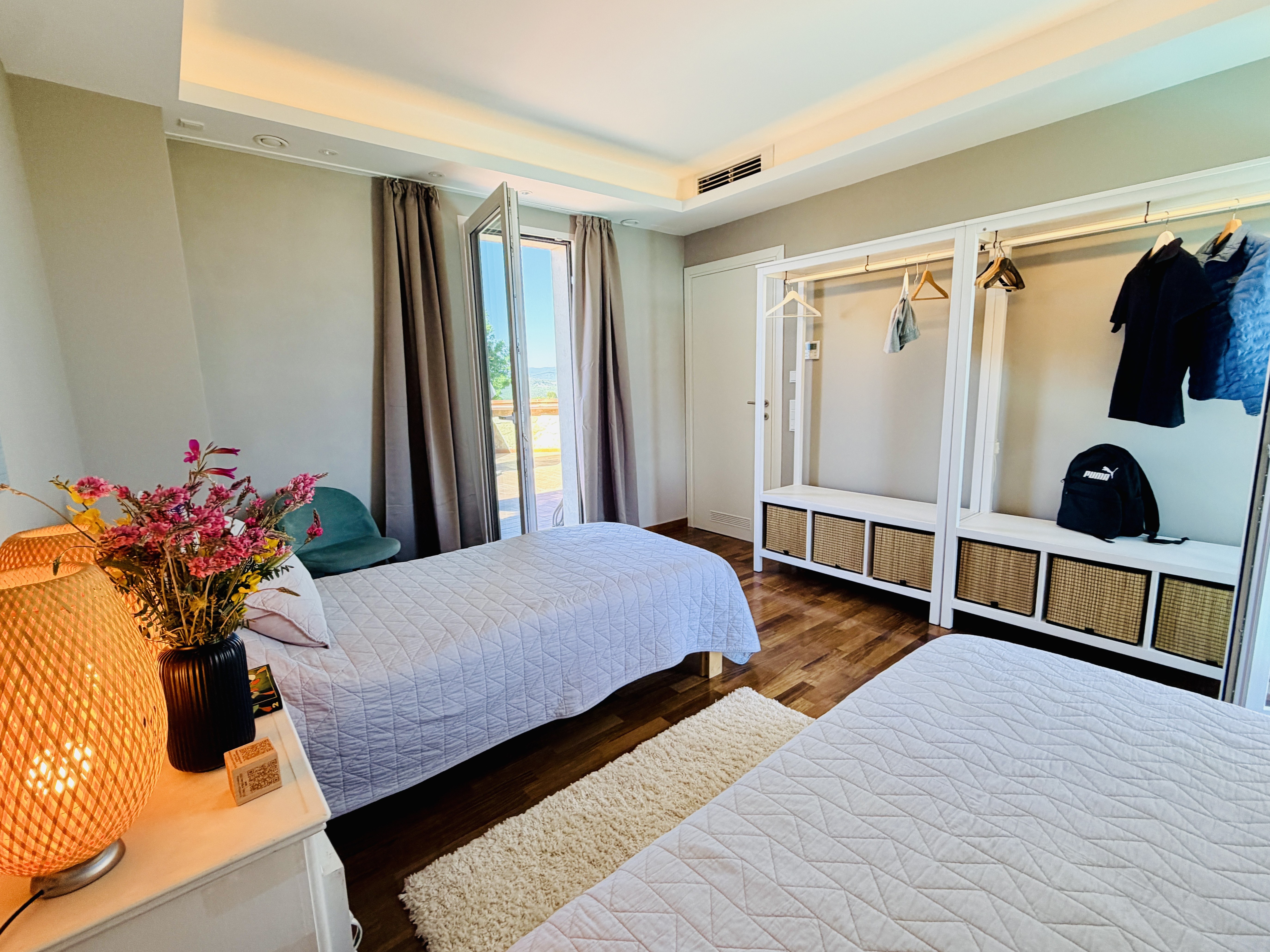 Bedroom 4 with open wardrobe and terrace view